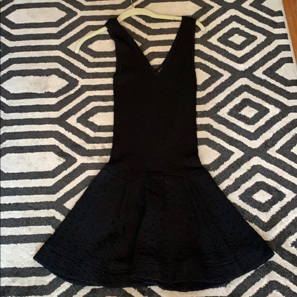 Black dress with peplum skirt